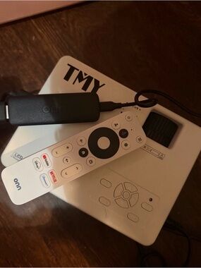 WHITE PROJECTOR WITH ONN TV REMOTE AND FIRE STICK.